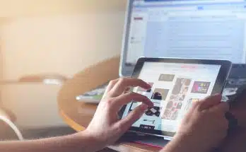 person holding black iPad