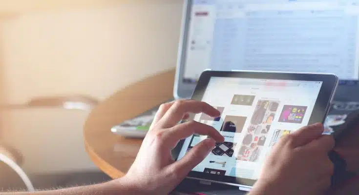 person holding black iPad